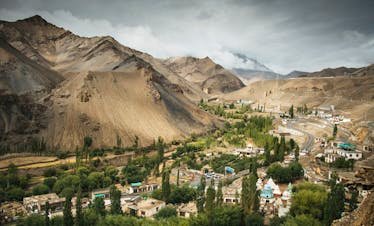 Breathtaking landscape view of Lamayuru Monastery nestled amidst the rugged mountains of Ladakh.