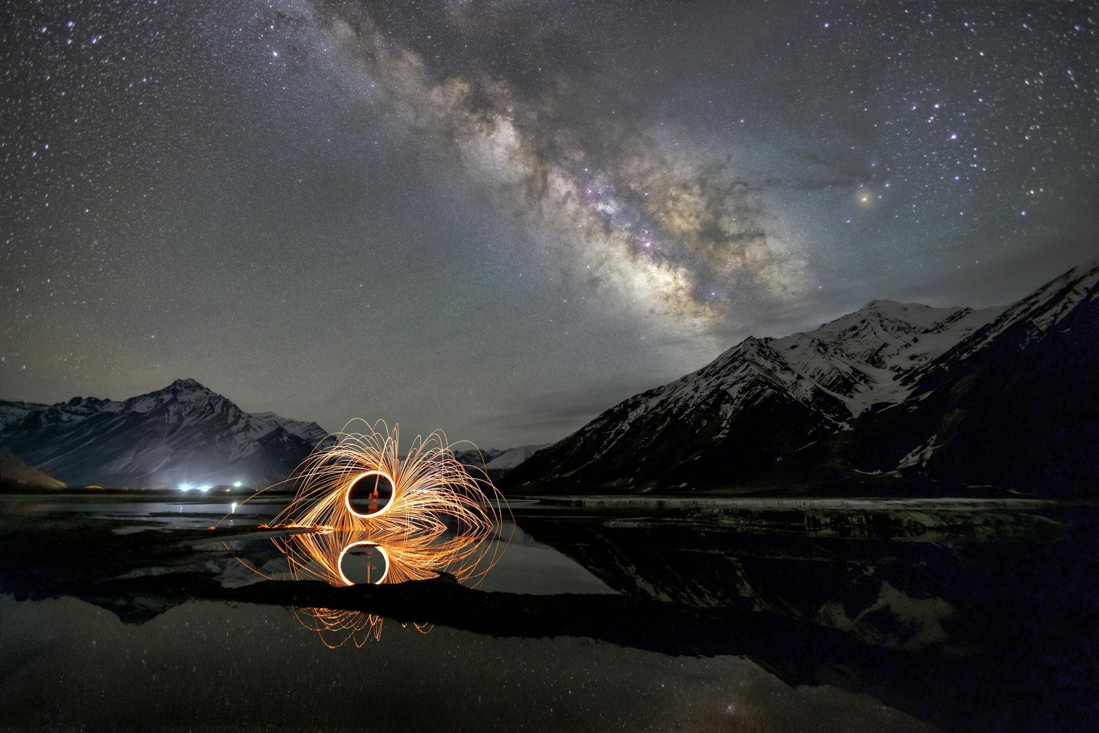 Breathtaking night sky over Zanskar with Milky Way and light art reflection.