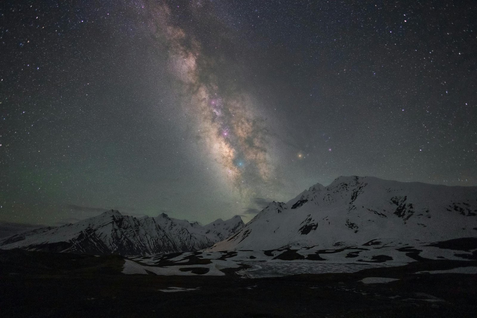 Breathtaking nightscape of the Milky Way above the snowy peaks of Zanskar mountains.