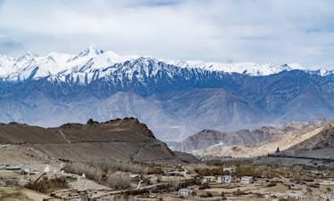 Breathtaking view of snow-capped Himalayan mountains and scenic Leh valley in India.
