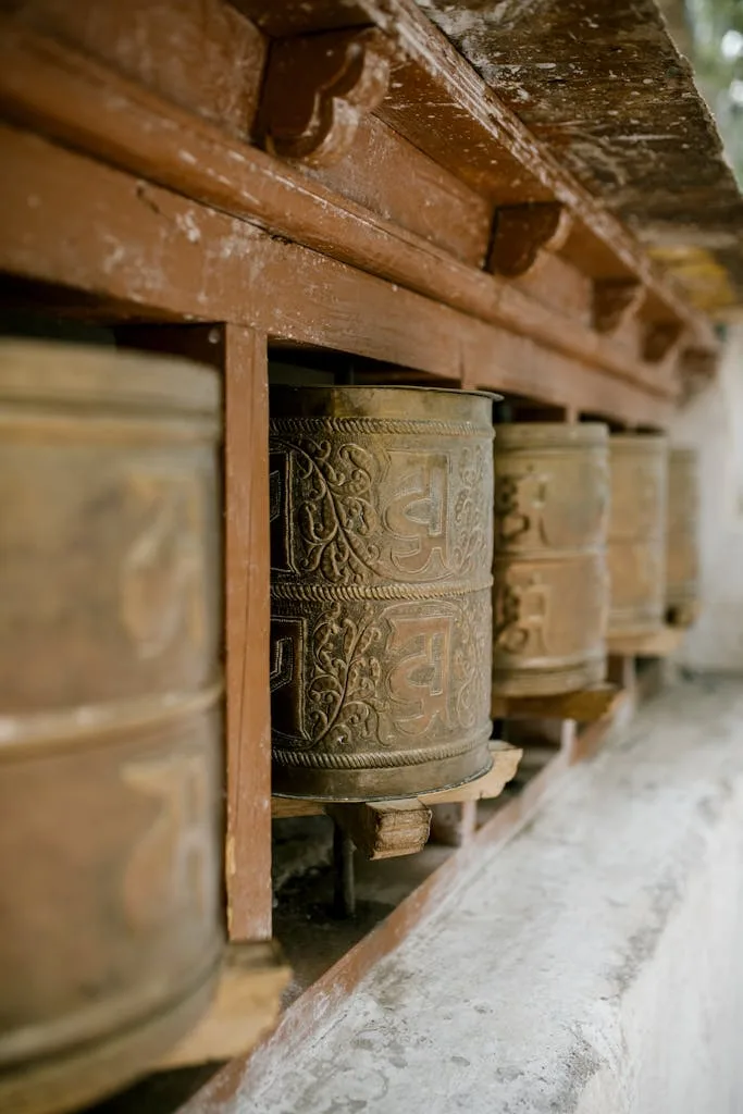 Buddhist Prayer wheels Rustic Buddhist prayer wheels at a monastery in Leh, India.